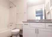 Thumbnail 20 of 33 - a bathroom with a sink toilet and bathtub