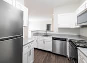 Thumbnail 3 of 34 - Renovated kitchen featuring appliances at Center Point Apartments, Indianapolis