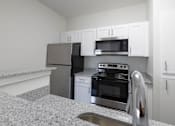 Thumbnail 4 of 34 - Renovated kitchen featuring appliances at Center Point Apartments, Indianapolis