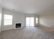 Thumbnail 26 of 34 - Living room with fireplace at Center Point Apartments, Indianapolis