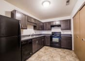Thumbnail 2 of 18 - kitchen with dark cabinets 