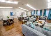 Thumbnail 3 of 18 - resident lounge with couches and table