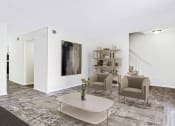 Thumbnail 9 of 10 - a living room with a couch and chairs and a coffee table at Elea Apartments in Marietta, GA