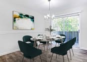 Thumbnail 7 of 10 - a dining room with a table and chairs at Elea Apartments in Marietta, GA