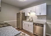 Thumbnail 1 of 27 - Kitchen Bar With Granite Counter Top at Rosemont Vinings Ridge, Atlanta, 30339