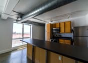 Thumbnail 10 of 23 - Granite Countertop Kitchen at Janus Lofts, Managed by Buckingham Urban Living, Indianapolis, Indiana