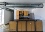 Thumbnail 3 of 23 - Fully Equipped Kitchen at Janus Lofts, Managed by Buckingham Urban Living, Indianapolis, IN