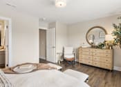 Thumbnail 21 of 45 - Bedroom with bed, nightstands, and natural light from large windows at Mural Lewis Center