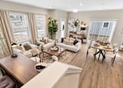 Thumbnail 12 of 45 - Living room with seating, natural light, and open layout at Mural Lewis Center