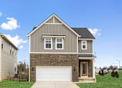 Thumbnail 38 of 45 - Rental home with attached two-car garage and driveway at Mural Lewis Center