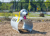 Thumbnail 51 of 53 - A metal sculpture of a dog with a yellow ribbon around its neck.