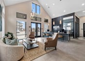 Thumbnail 14 of 20 - Stylish leasing office at Nook Nine with modern seating, high ceilings, and warm natural light.