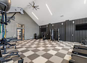 Thumbnail 18 of 20 - Modern fitness center at Nook Nine with top-tier cardio, strength equipment, and sleek design.