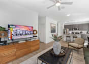 Thumbnail 5 of 20 - Stylish open-concept living at Nook Nine with modern decor, wood-style flooring, and gourmet kitchen.