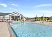 Thumbnail 50 of 53 - A large swimming pool with a building next to it.
