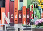 Thumbnail 67 of 68 - a sign for a restaurant with a city skyline on it at Gramercy Apartments, Carmel Indiana