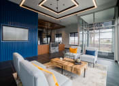 Thumbnail 14 of 36 - a living room with blue walls and white furniture at The Century at Purdue Research Park-Student, West Lafayette, IN 47906