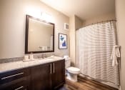 Thumbnail 11 of 36 - a large bathroom with a shower toilet and sink at The Century at Purdue Research Park-Student, Indiana, 47906