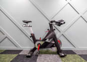 Thumbnail 13 of 34 - an exercise bike parked in a home gym at 310 at Nulu Apartments-Student, Louisville, KY 