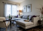 Thumbnail 22 of 34 - a living room with couches and chairs and a table at 310 at Nulu Apartments-Student, Kentucky, 40202