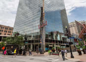 Thumbnail 32 of 34 - a tall building with a reflection of the sky in it at 310 at Nulu Apartments-Student, Louisville