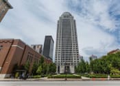 Thumbnail 33 of 34 - a tall building in the middle of a city street at 310 at Nulu Apartments-Student, Louisville, KY