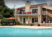 Thumbnail 10 of 21 - a large swimming pool in front of a house at Landmark at Lyncrest Reserve Apartments, Nashville, 37209