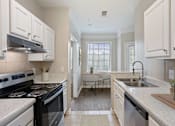 Thumbnail 2 of 33 - Efficient Appliances In Kitchen at Village at Almand Creek, Georgia