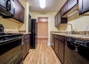 Thumbnail 28 of 28 - Updated Kitchen With Black Appliances at The Plaza at Library Square, Indiana, 46204
