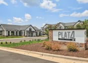 Thumbnail 38 of 38 - a pata sign in front of a parking lot with houses in the background