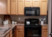 Thumbnail 14 of 32 - Stone countertops in kitchen at The Reserve at Williams Glen Apartments, 2201 Williams Glen Blvd, Indiana