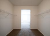 Thumbnail 27 of 37 - a walk in closet in a bedroom at the oxford at estonia apartments in san an