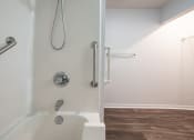Thumbnail 36 of 37 - a bathroom with a shower and a toilet