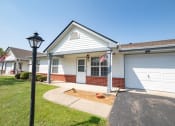 Thumbnail 9 of 37 - a house with a flag on a pole in front of it