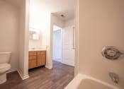 Thumbnail 21 of 37 - a bathroom with a toilet sink and bathtub
