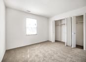 Thumbnail 4 of 25 - Large bedroom with two closets at Somerset Apartments in Marion, IN.