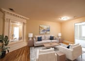 Thumbnail 12 of 28 - Staged living room at The Plaza at Library Square Apartments, 902 N. Pennsylvania Street, Indianapolis