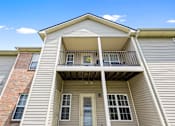 Thumbnail 49 of 65 - Apartment building featuring private patios and covered balconies, offering outdoor living space at Steeplechase at Shiloh Crossing Apartments in Avon, Indiana.