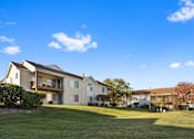 Thumbnail 26 of 27 - A building with large green space and views at The Winds at Poplar Creek Apartments , Schaumburg