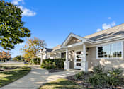Thumbnail 11 of 27 - The clubhouse entrance at The Winds at Poplar Creek Apartments , Schaumburg, 60194