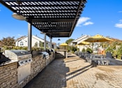 Thumbnail 21 of 27 - BBQ and grilling area at The Winds at Poplar Creek Apartments , Schaumburg, 60194