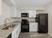 Thumbnail 1 of 27 - A newly renovated kitchen at The Winds at Poplar Creek Apartments , Illinois