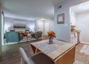Thumbnail 7 of 38 - an open living room and dining room with a table and chairs