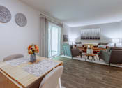 Thumbnail 6 of 38 - a living room and dining room with a table and chairs