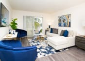 Thumbnail 9 of 23 -  Living Room with Wood-Style Floors and Patio Access at Aqua 2800, Oakland Park, FL 33309