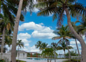 Thumbnail 4 of 23 - Pool area with lounge chairs at Aqua 2800, Oakland Park