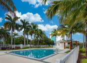 Thumbnail 6 of 23 - Swimming Pool with Lush Landscaping and a Cabana at Aqua 2800, Oakland Park Florida