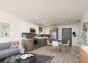 Thumbnail 9 of 33 - Pet-Friendly Apartments in Downtown Sacramento, CA - Mod at Midtown - Open Concept Living Area with Plank Wood Flooring, View of Modern Two-Tone Kitchen with Stainless Steel Appliances and Quartz Countertops