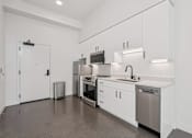 Thumbnail 33 of 37 - Modern kitchen with white cabinets and sink at Luella, California, 95811