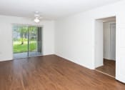 Thumbnail 20 of 24 - Living room with patio at Banyan Pointe, Coconut Creek